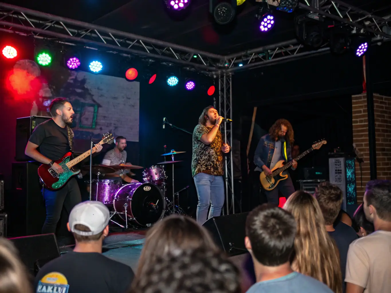 An image of a live music performance with diverse artists on stage, engaging an enthusiastic audience.